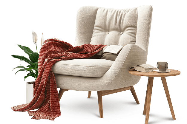 Sillón decorado con manta, libros, planta y mesa auxiliar